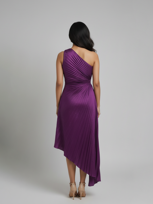 Woman wearing a purple one-shoulder dress on a gray background
