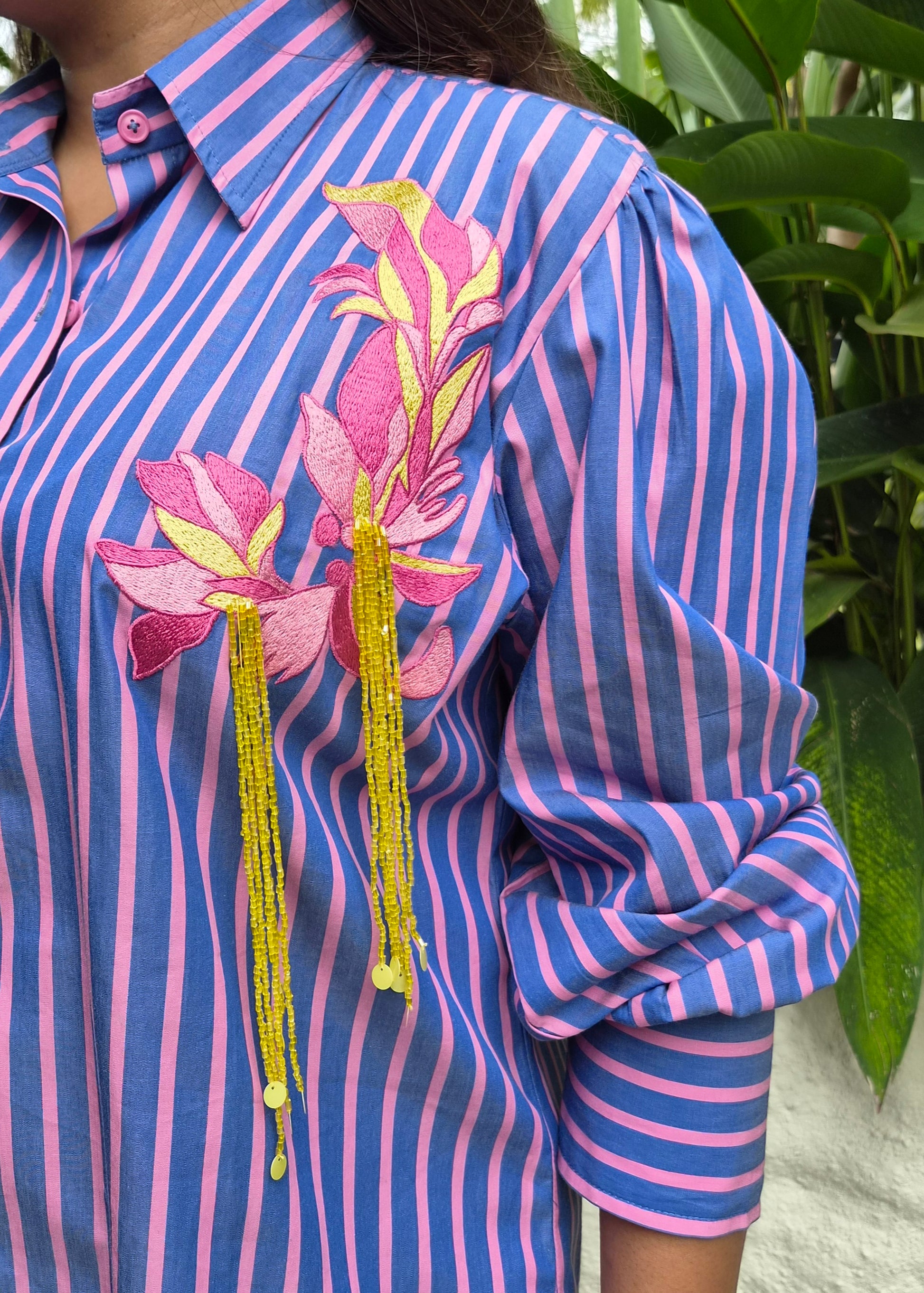 purple and Pink vertically striped button-down shirt with pink floral embroidery 