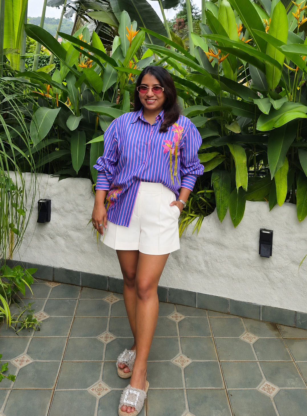 purple and Pink vertically striped button-down shirt with pink floral embroidery 