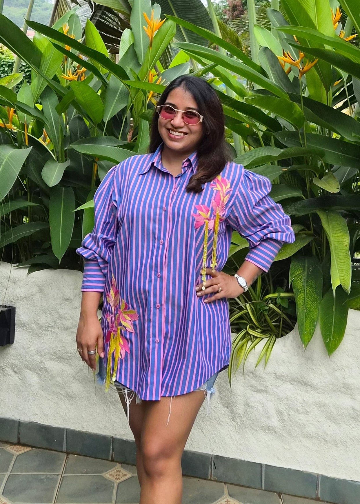 purple and Pink vertically striped button-down shirt with pink floral embroidery 