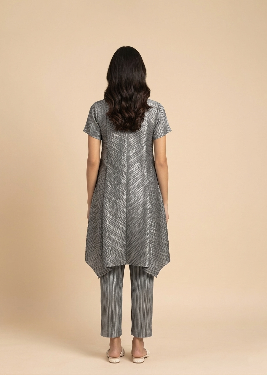 Woman wearing a gray striped outfit on a beige background