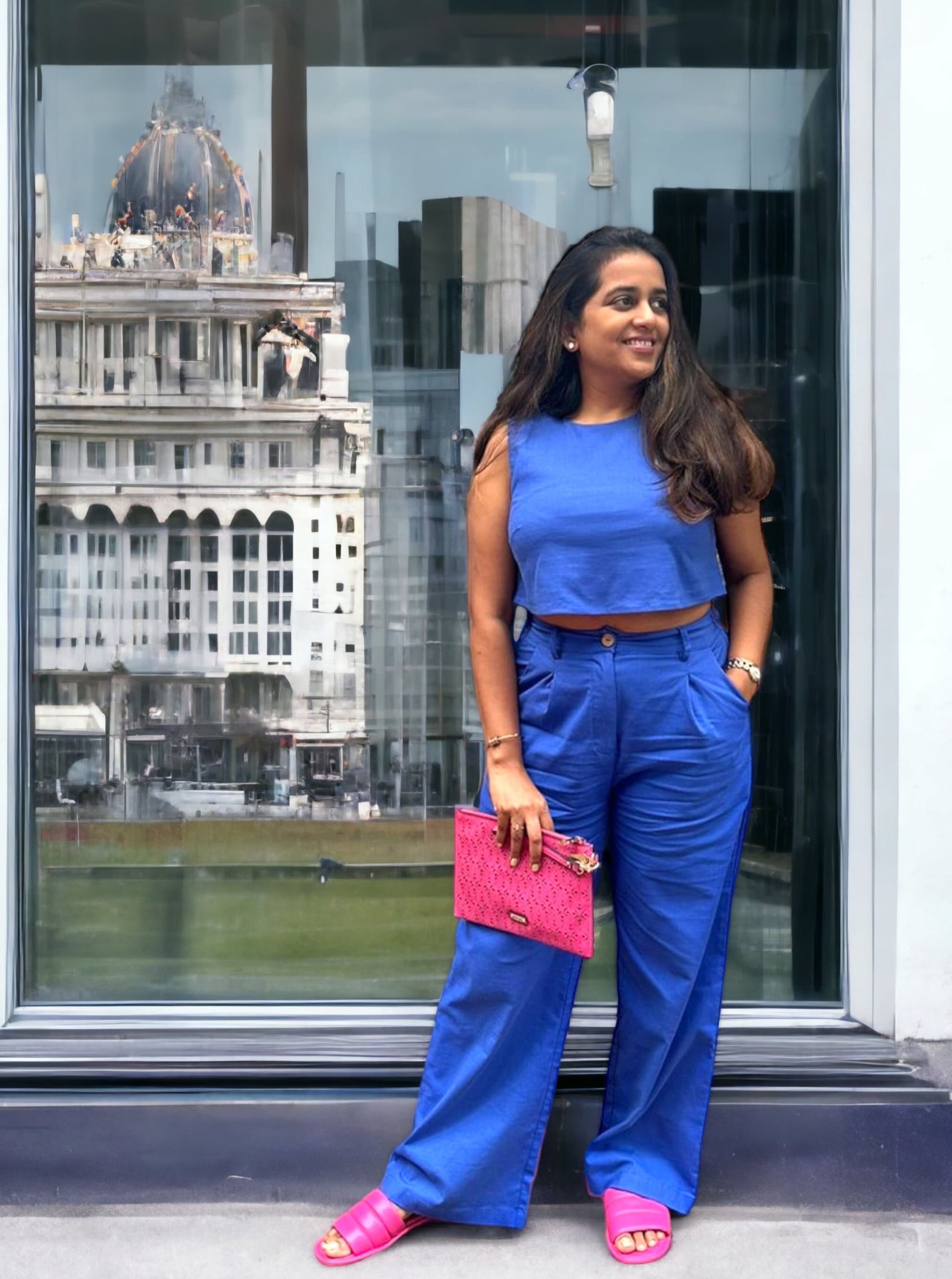 Featuring a Solid Blue Crop Top with Wide Leg Trousers with pockets. 